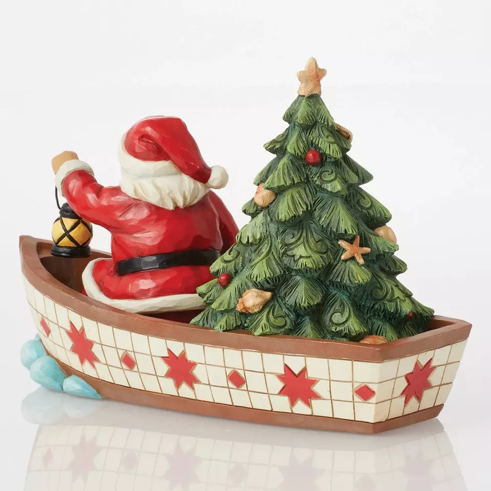 Santa in Boat With Tree Figurine