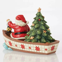 Santa in Boat With Tree Figurine