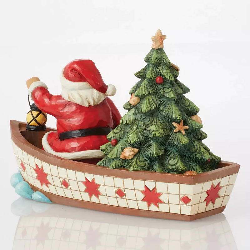 Santa in Boat With Tree Figurine